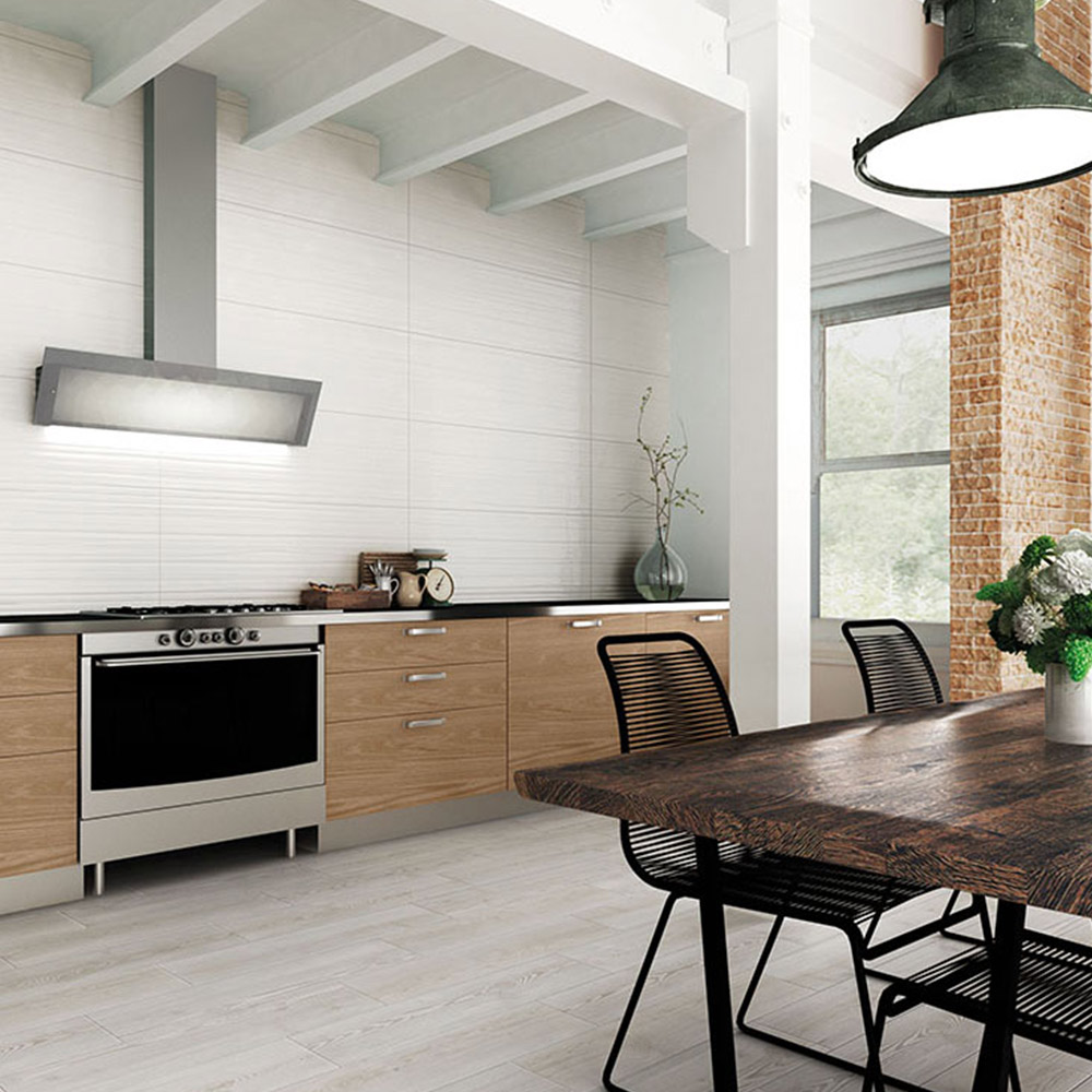 pared de cocina con azulejo blanco con relieve de gran formato